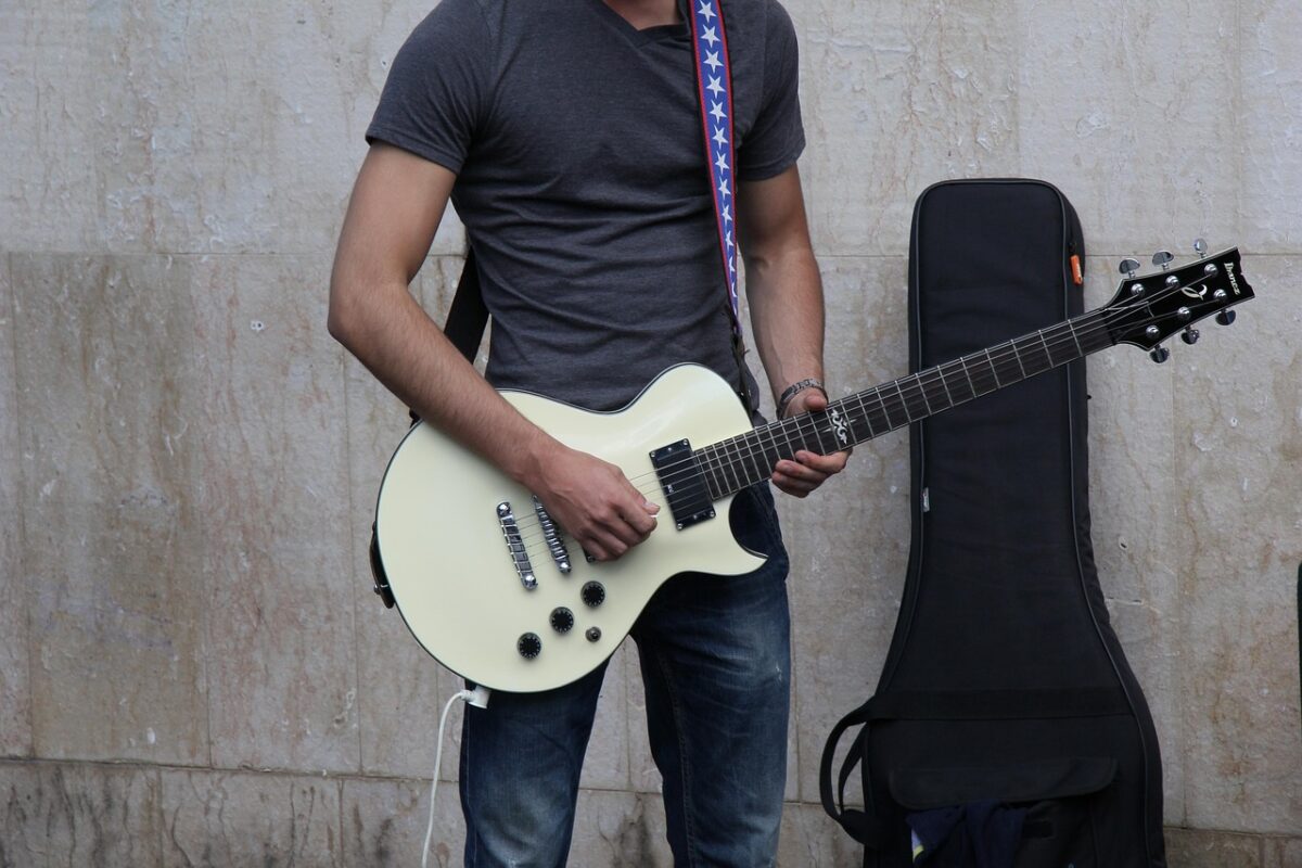 A suede guitar strap on an instrument
