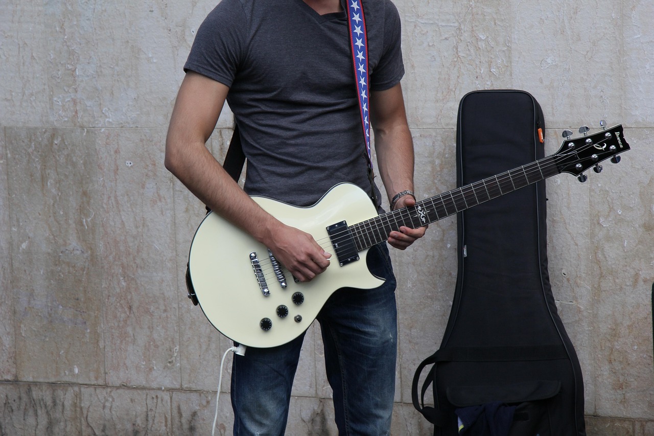 A suede guitar strap on an instrument