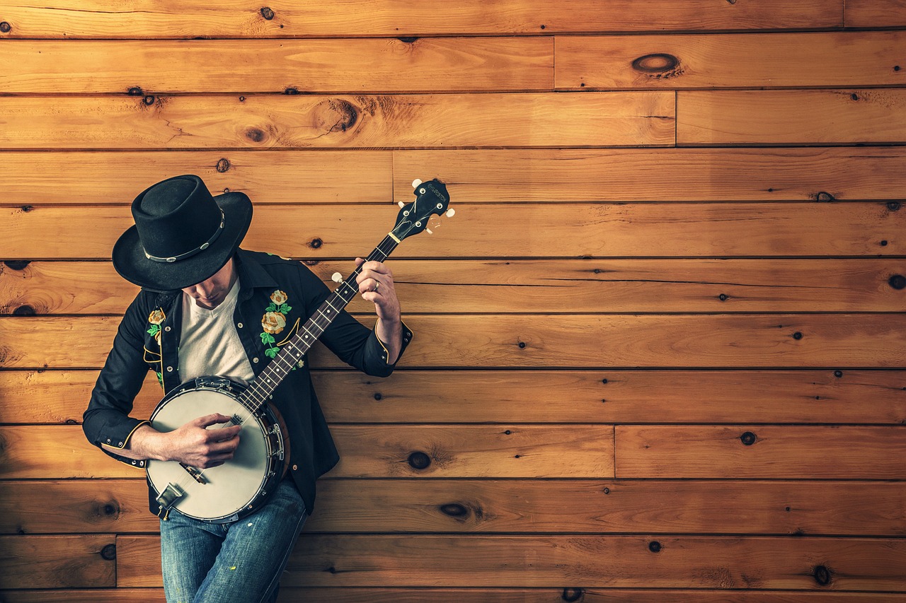 A guitar hanging from a wall mount